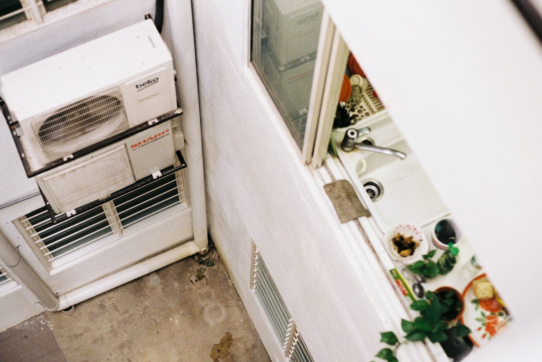 a-white-refrigerator-freezer-sitting-inside-of-a-kitchen-hscxnjrzwr8