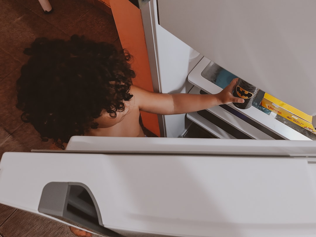 woman-in-white-tank-top-sitting-on-white-plastic-chair-9wmbuofr-o